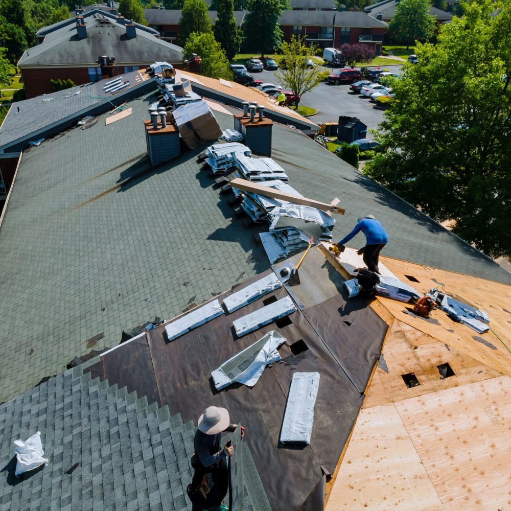 Construction worker on a renovation roof the house installed new shingles